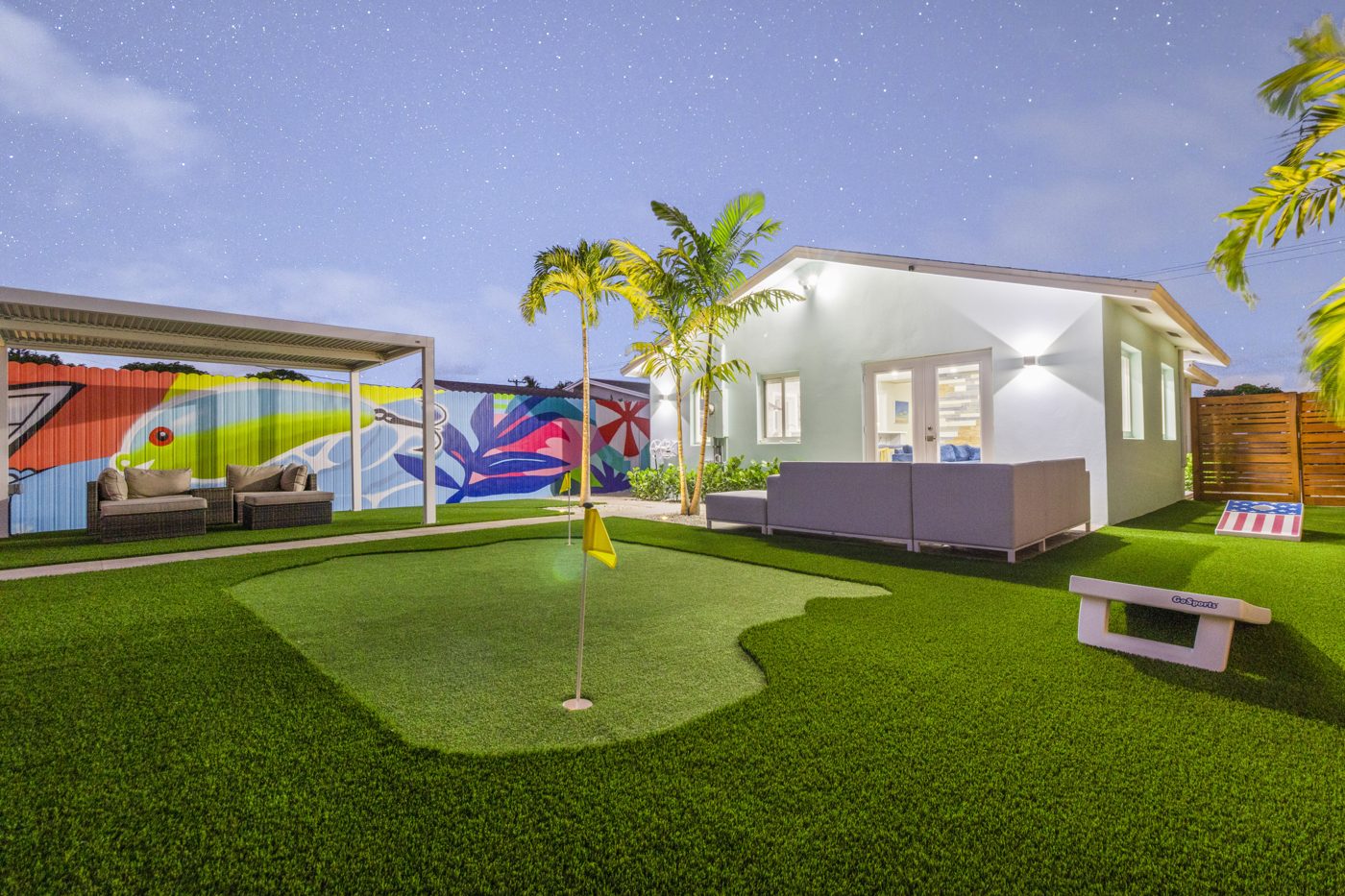 The backyard after — resort pool, mural and turf