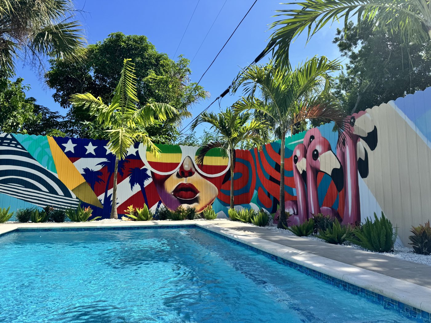 Resort pool against the signature mural wall