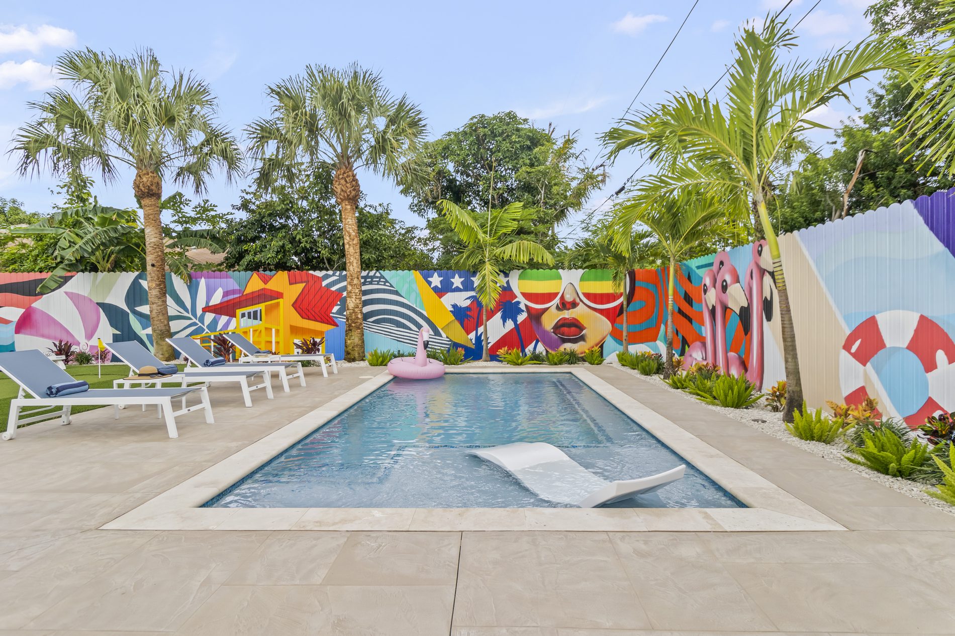 Delray Beach short-term rental — resort pool and mural backyard